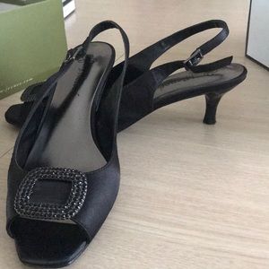 Black satin pumps